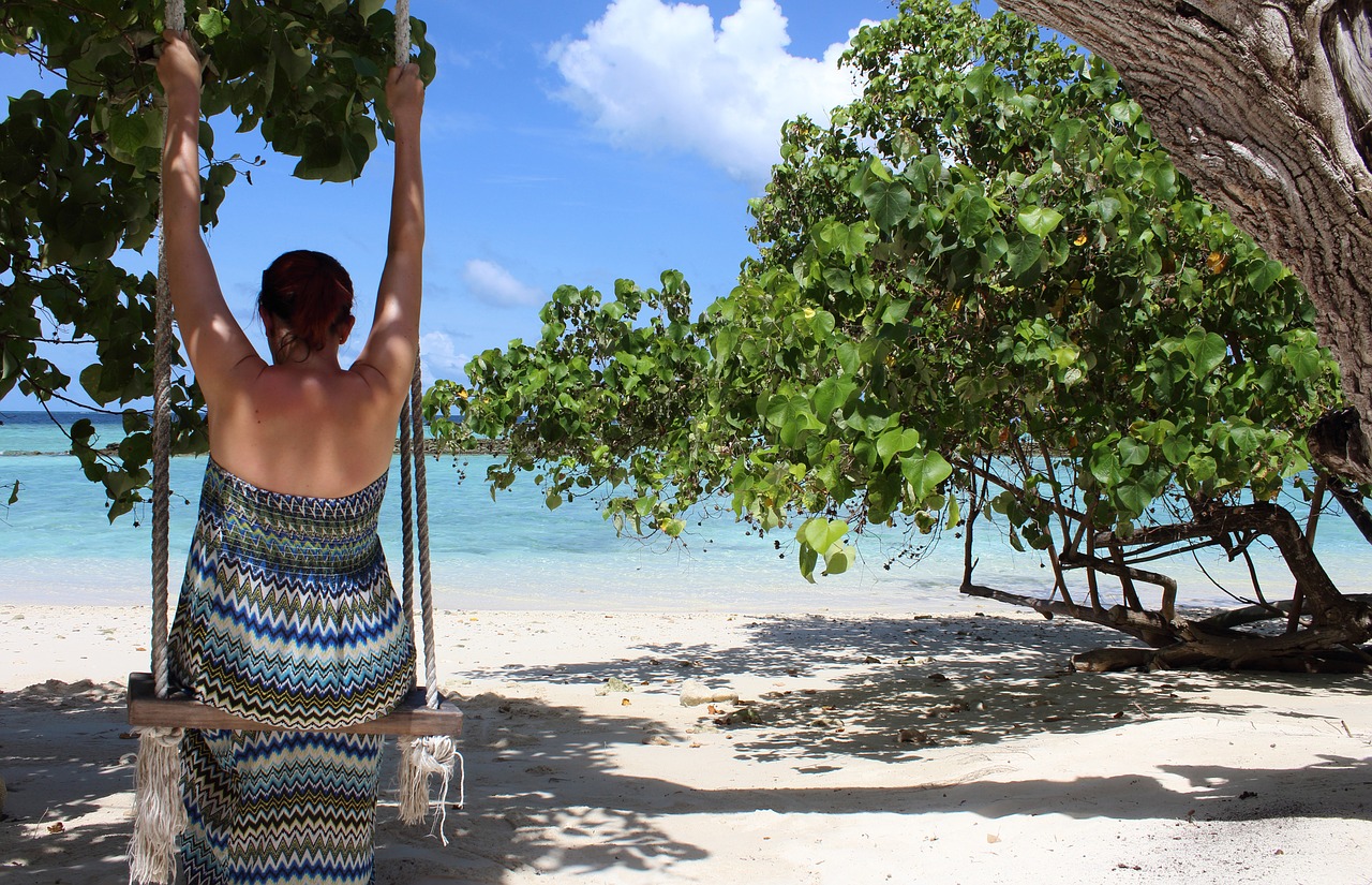 maldives woman on swing swing free photo