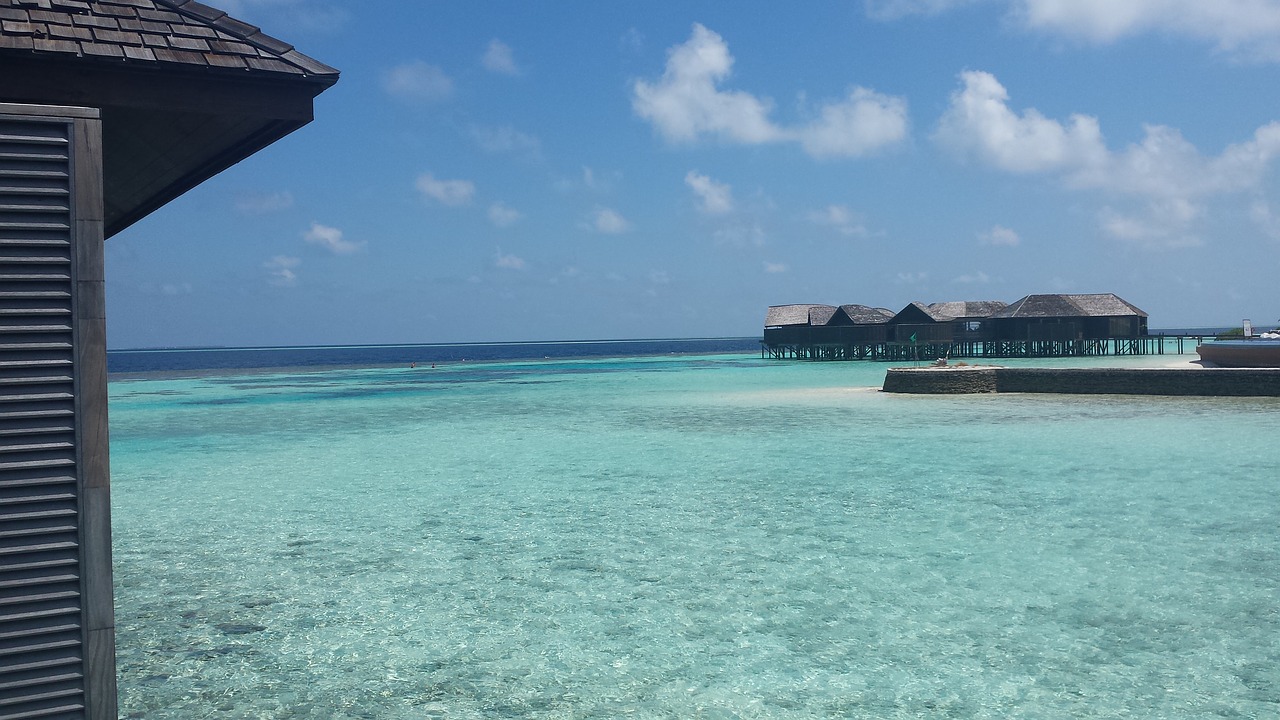 maldives island turquoise water tropical sky free photo