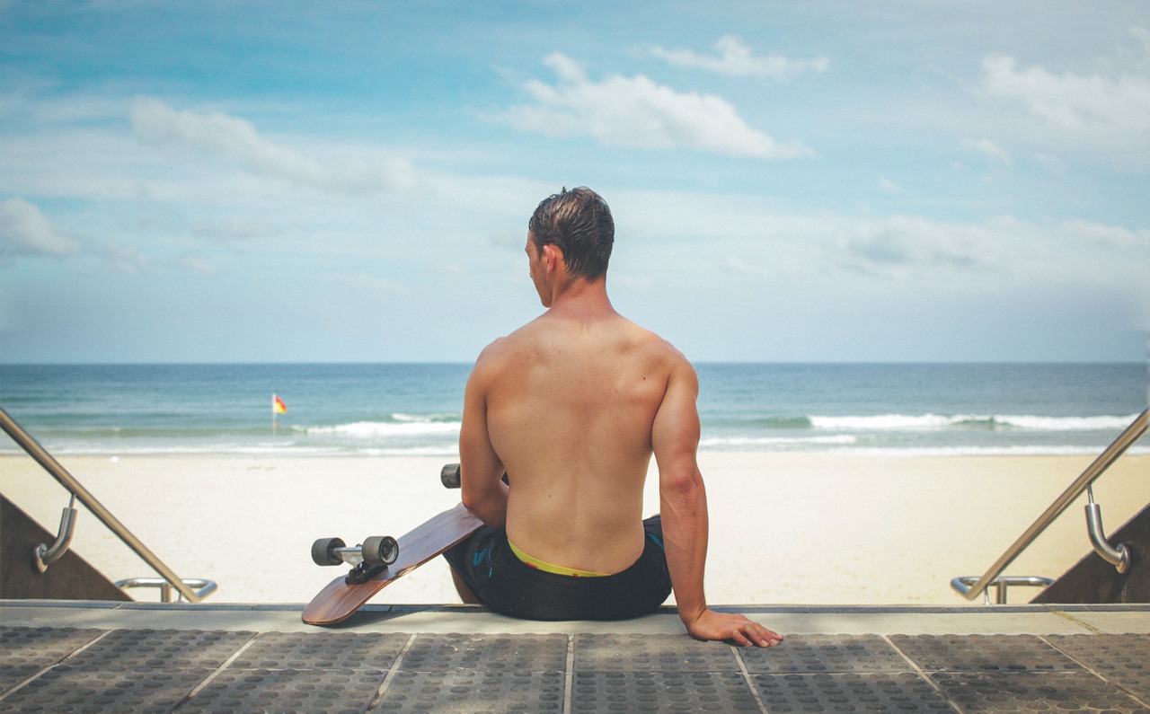 man sitting back free photo