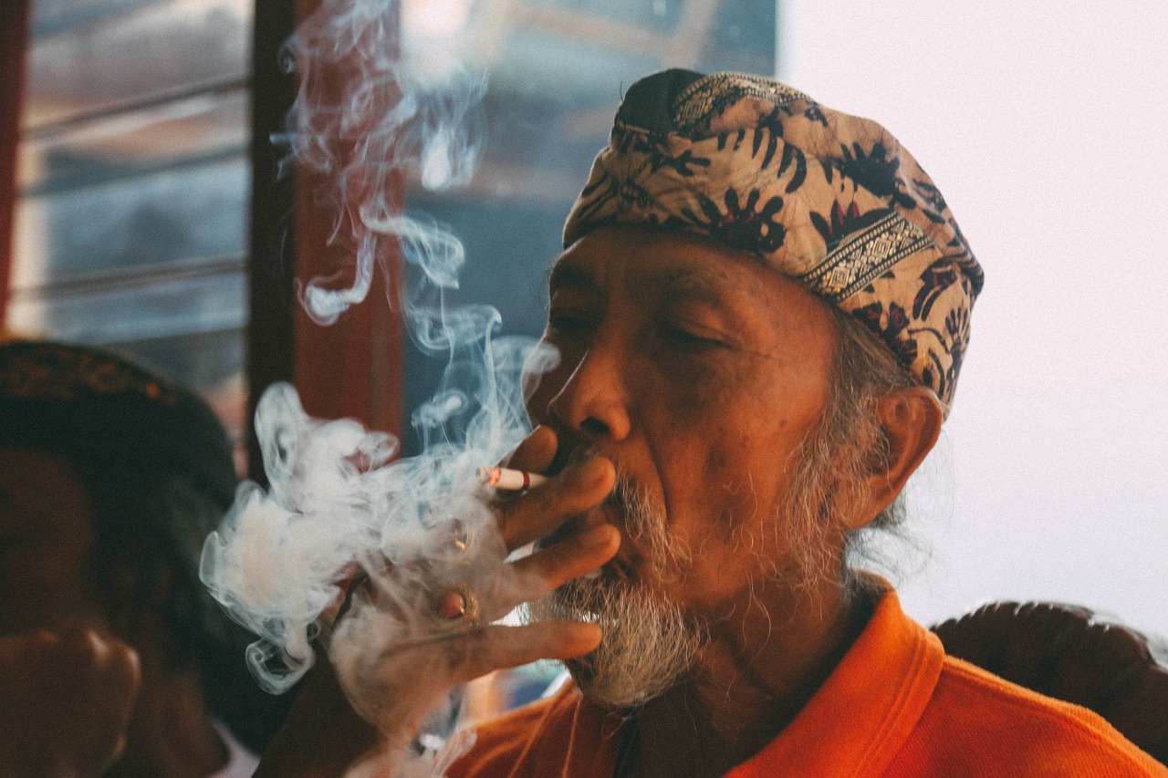 man smoking cigarette free photo