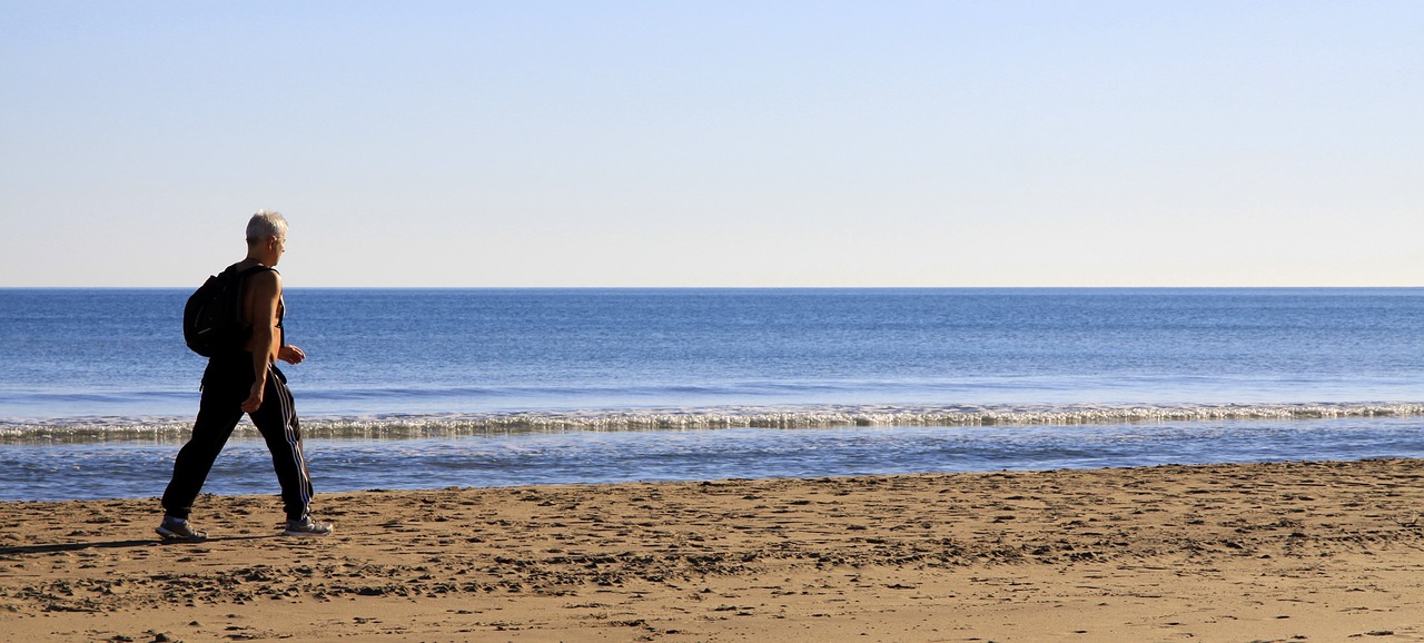 man walking beach free photo