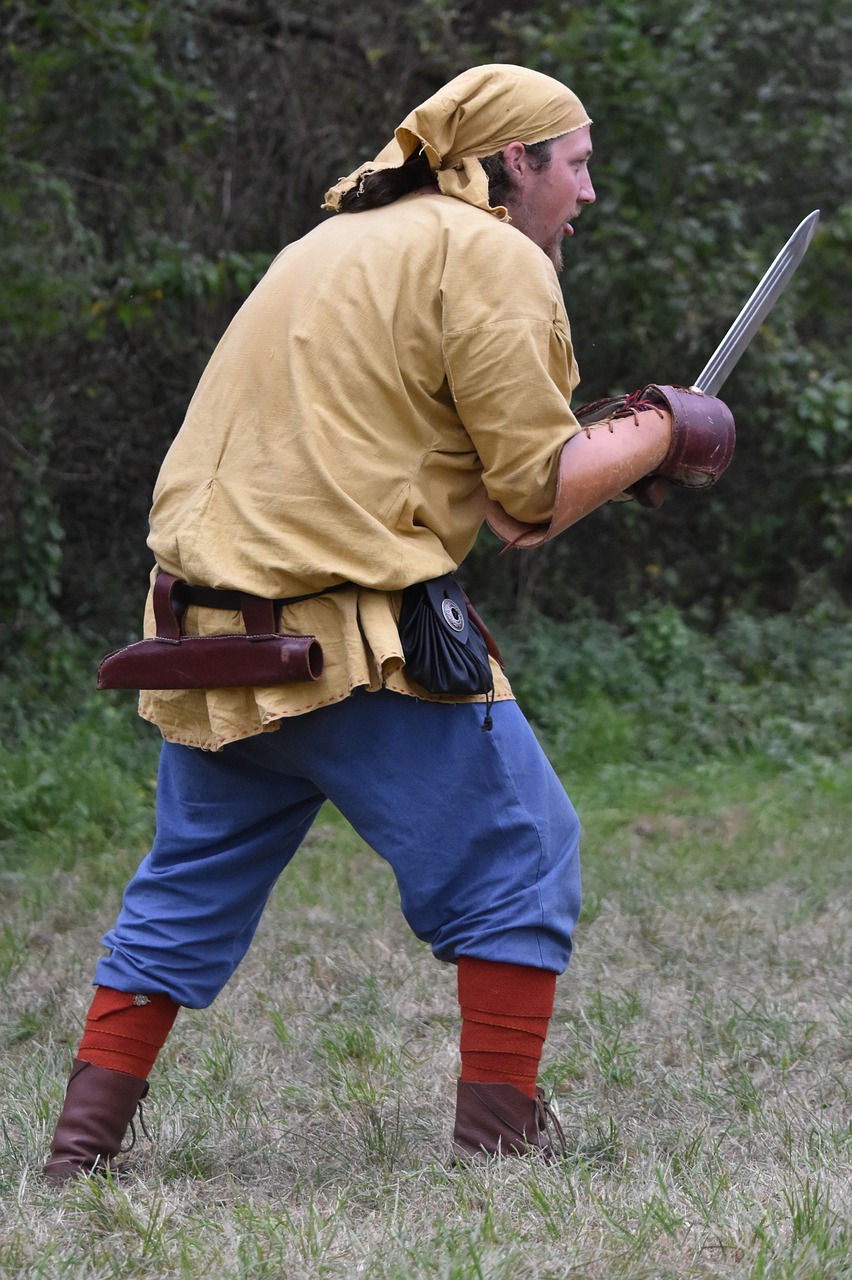 man fighting sword free photo