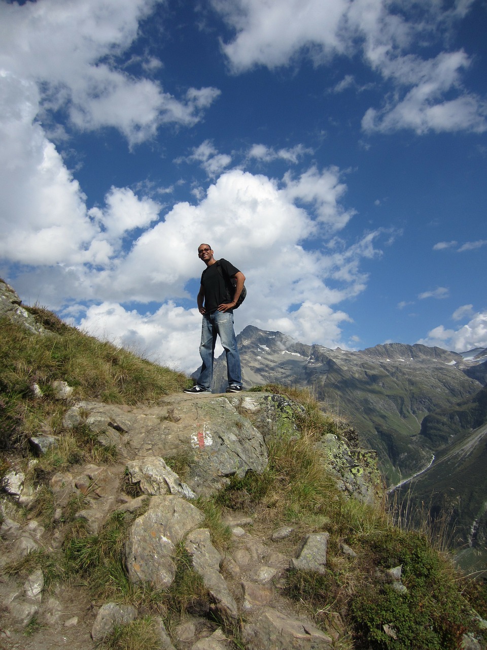 man top of mountain alps free photo