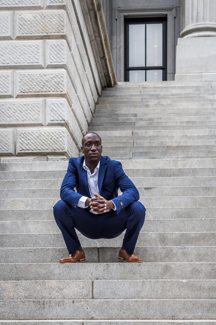 man sitting building free photo