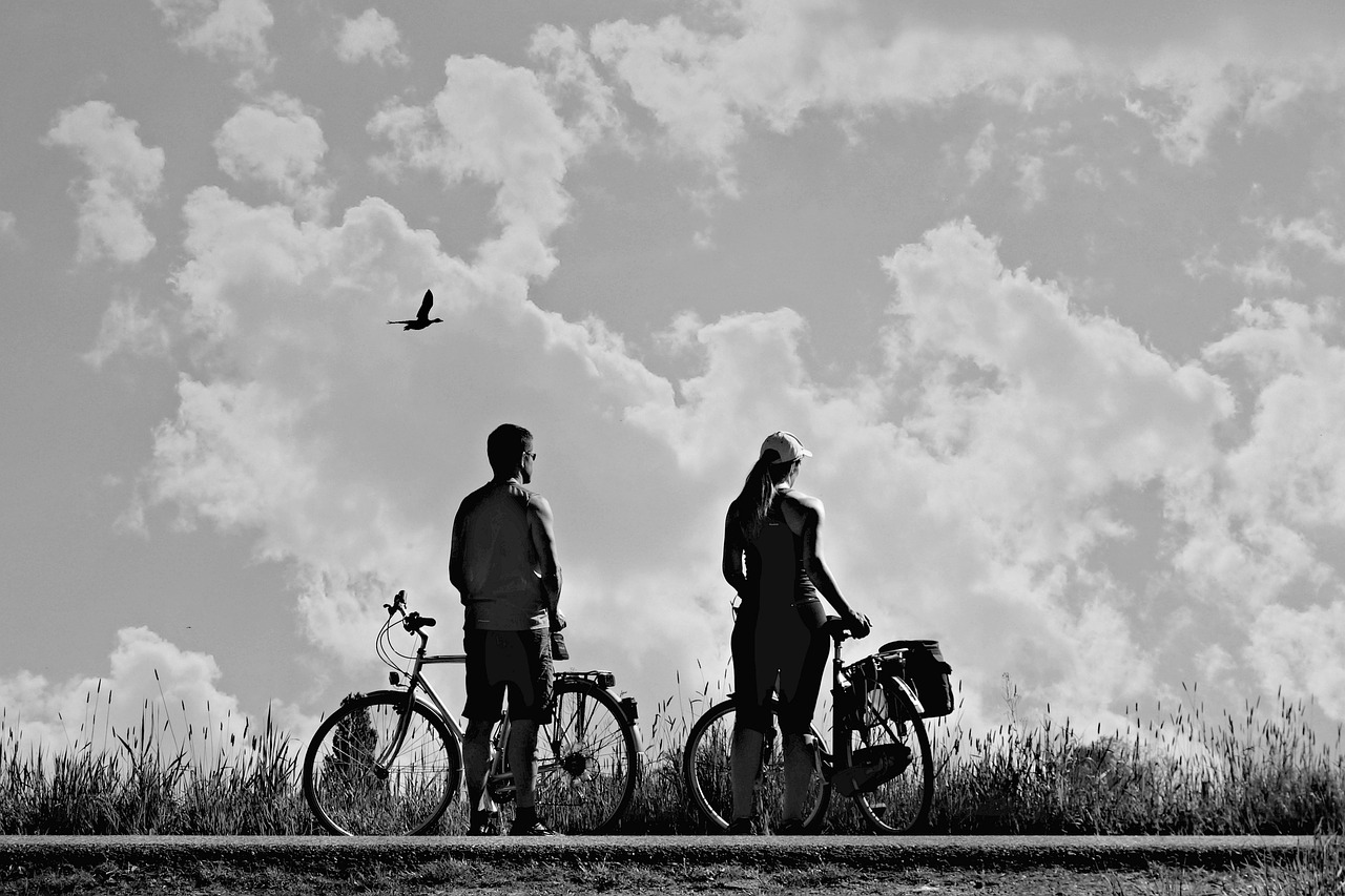 man  woman  bicycle ride free photo