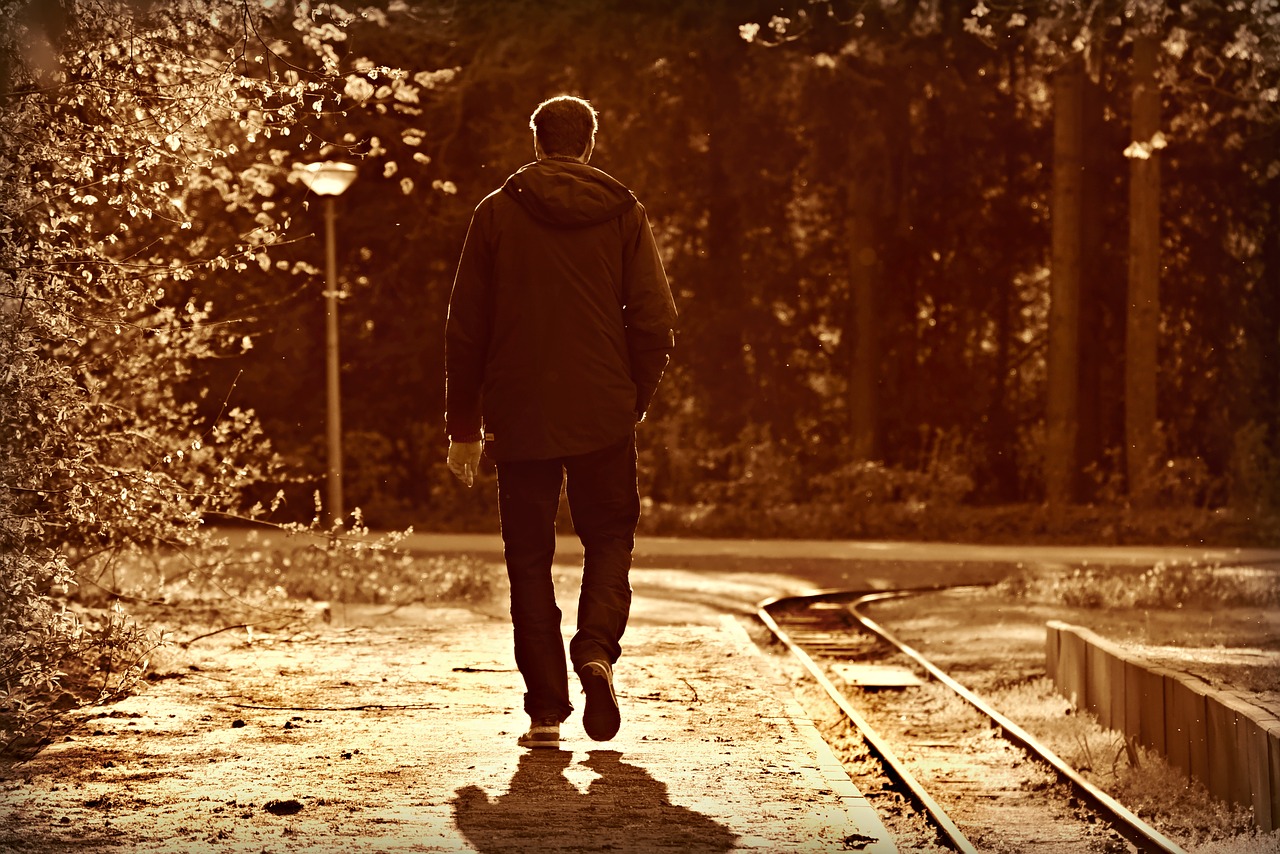 man  walking  railway free photo
