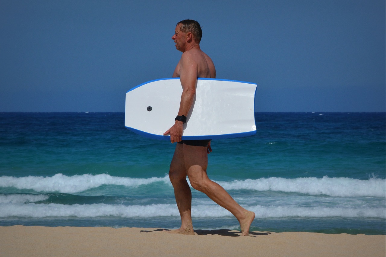 man surfboard sea free photo