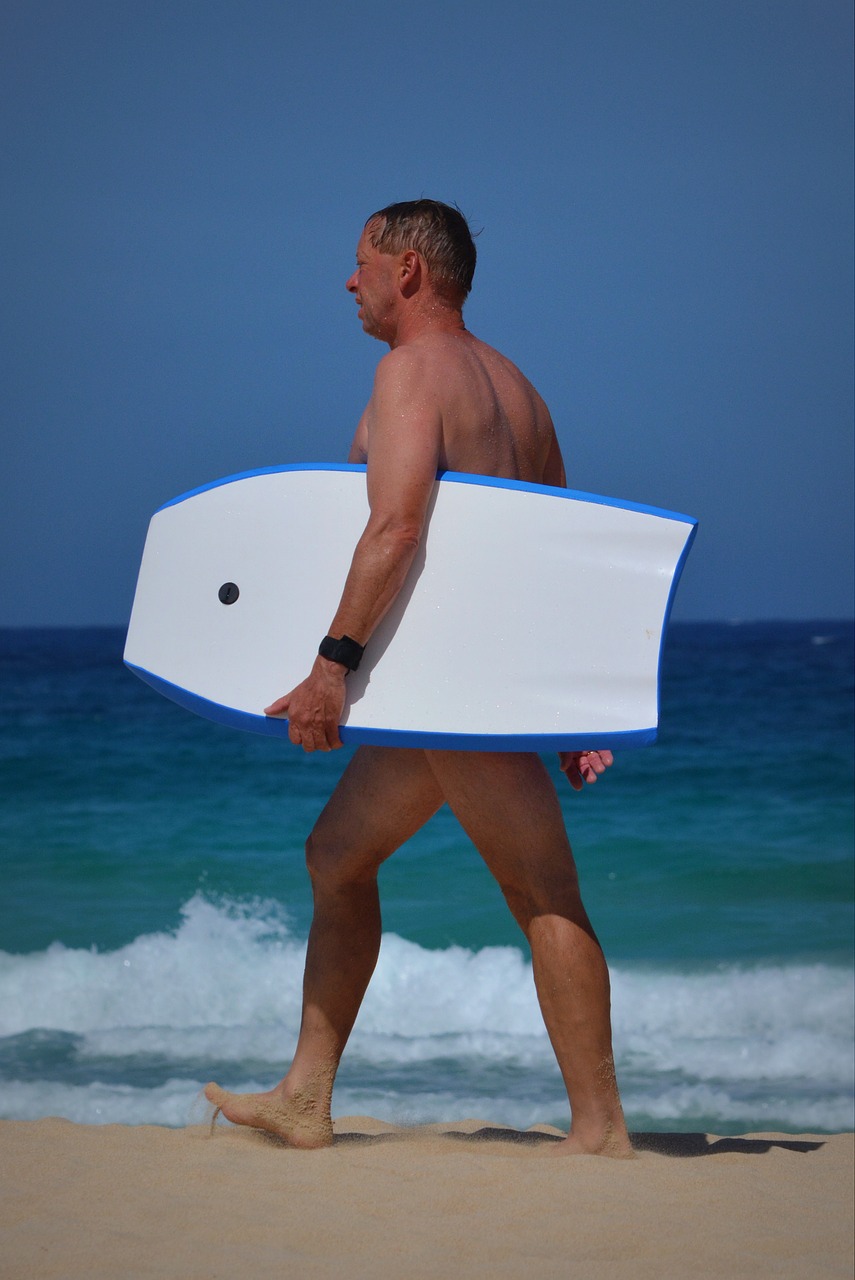 man surfboard sea free photo