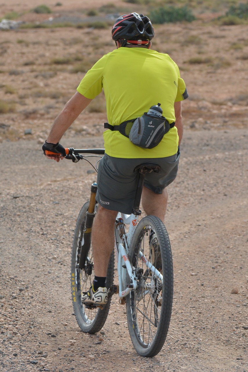 man cycling mountain bike free photo