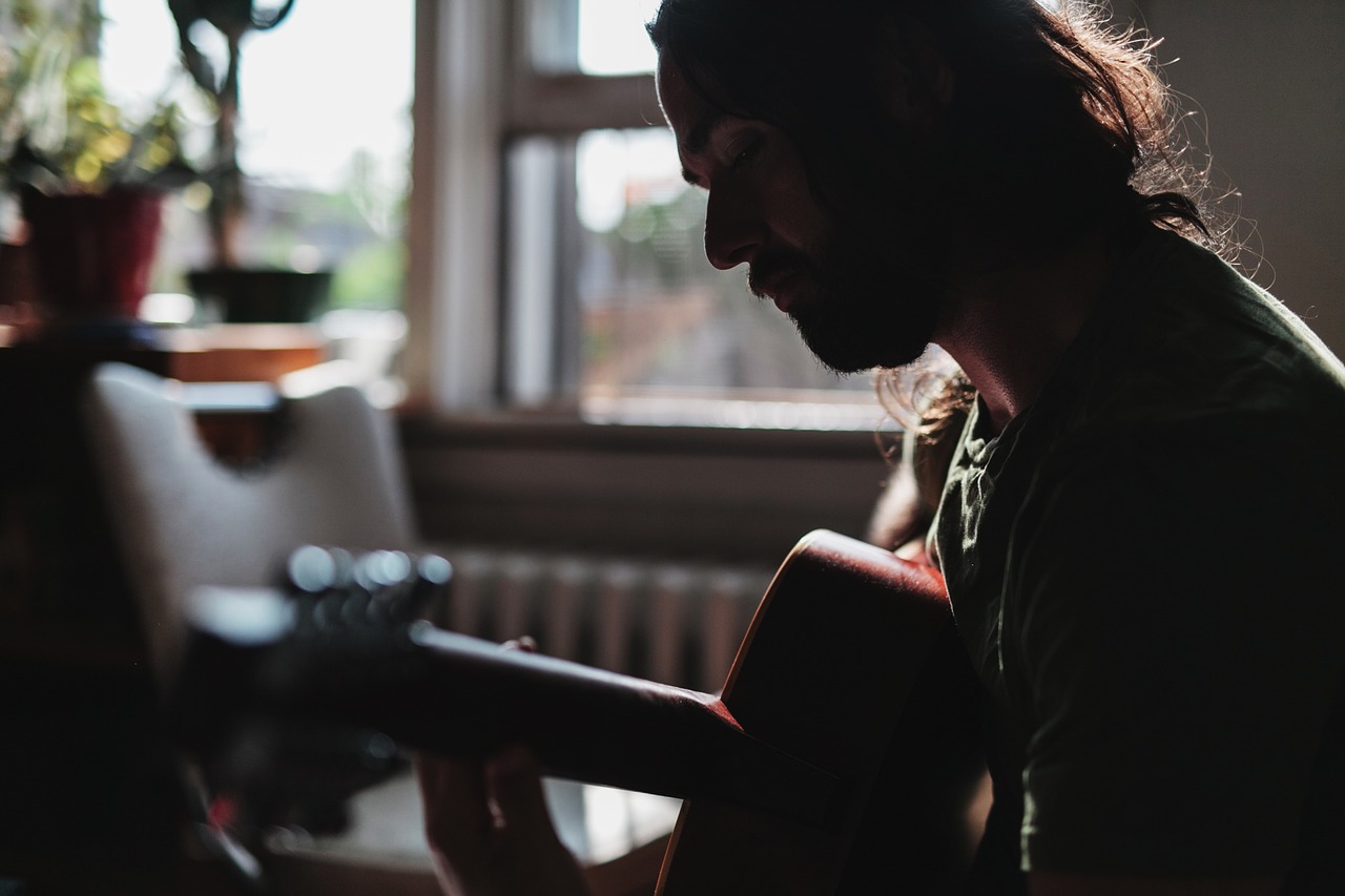 man playing guitar free photo