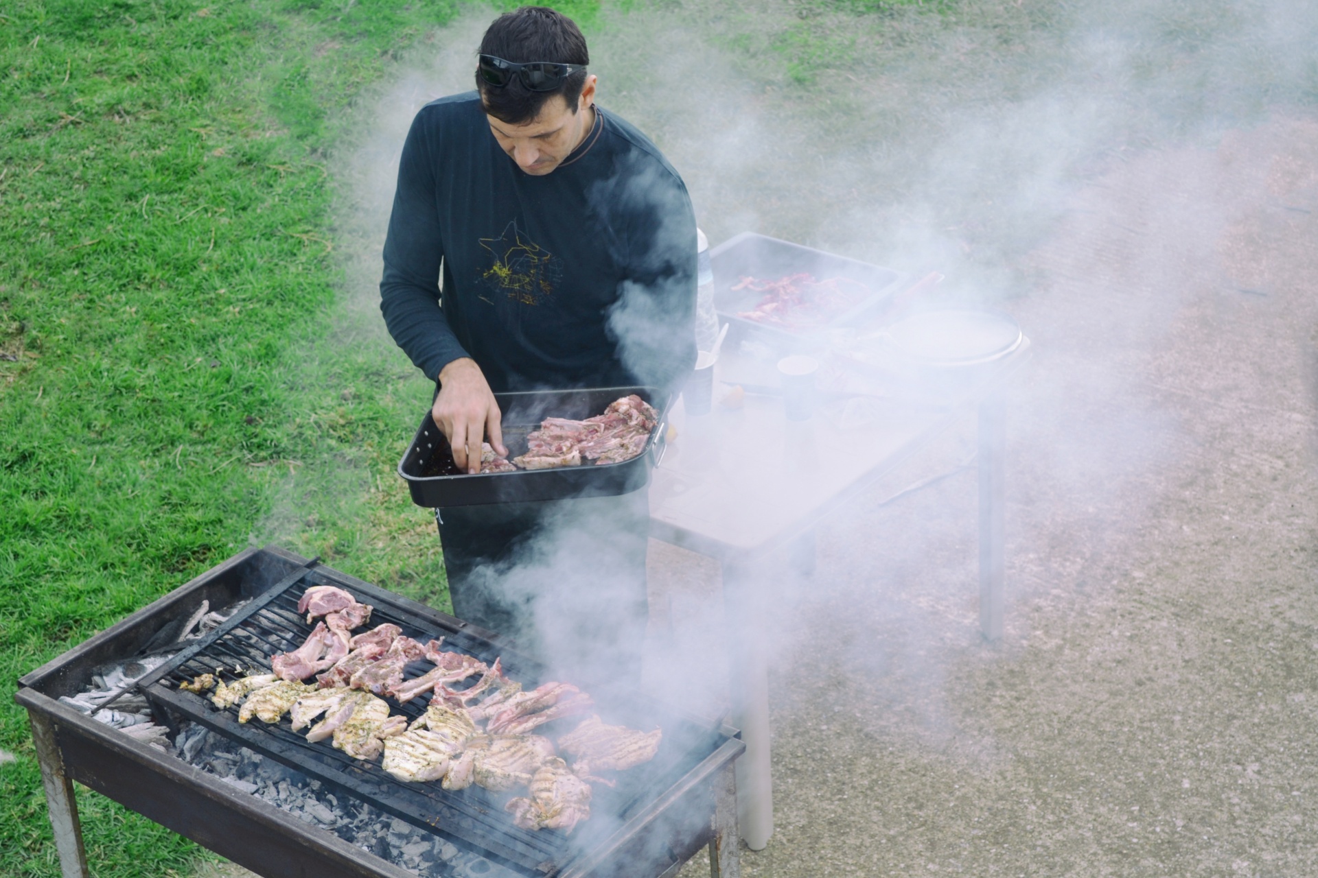man grilling meat free photo