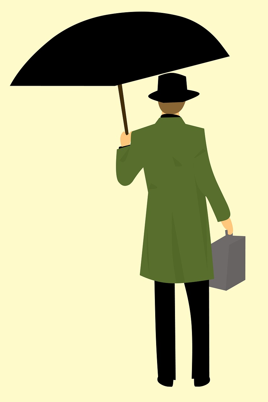 man return coat holding umbrella free photo