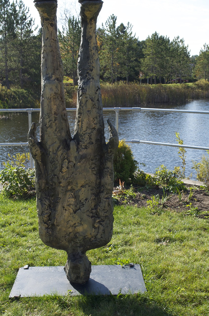 man standing on head statue art free photo