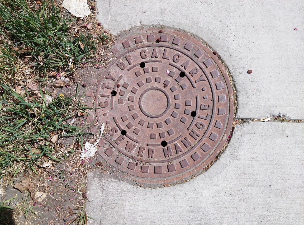 manhole calgary sidewalk free photo