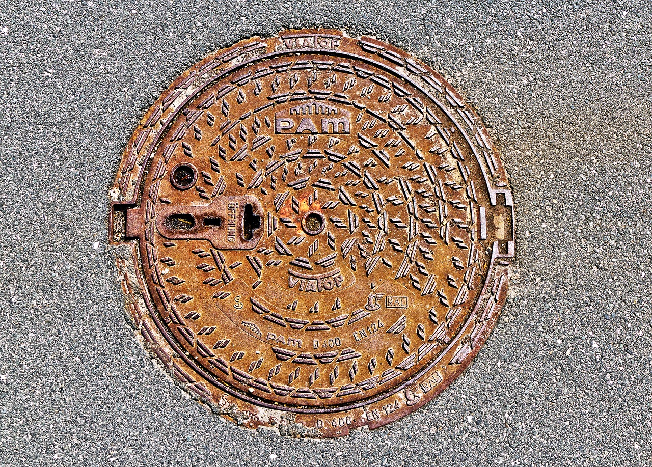 manhole cover rusty asphalt free photo
