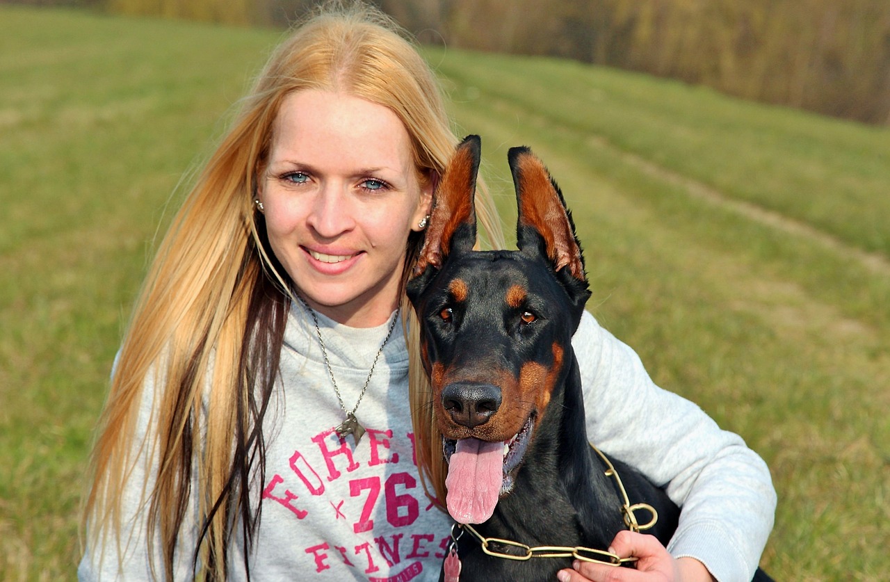 blonde woman doberman free photo