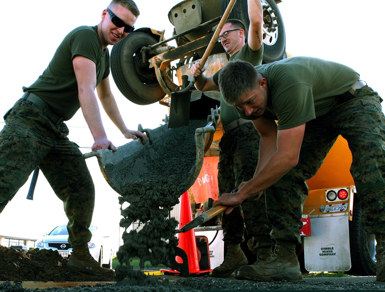 men working cement construction free photo