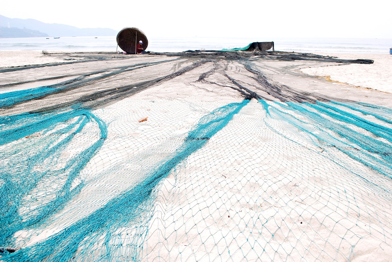 mending their nets the fishermen fishery free photo