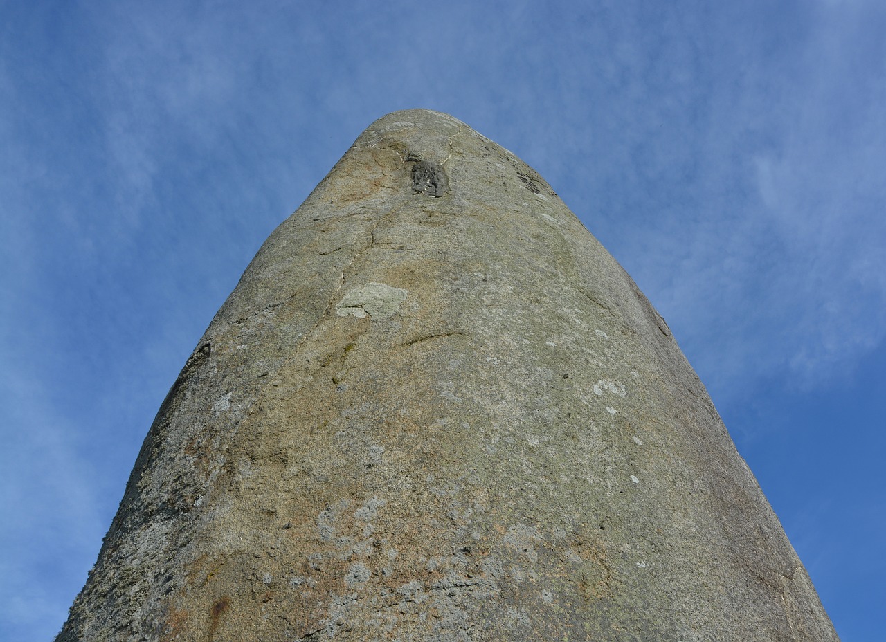 menhir pebbles giant menhir of champ dolent blue sky free photo