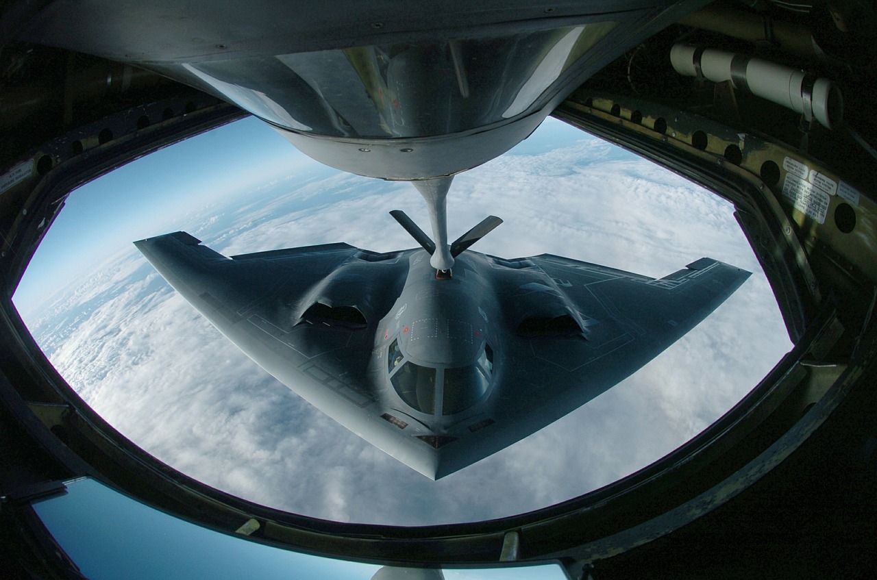 military stealth bomber refueling free photo