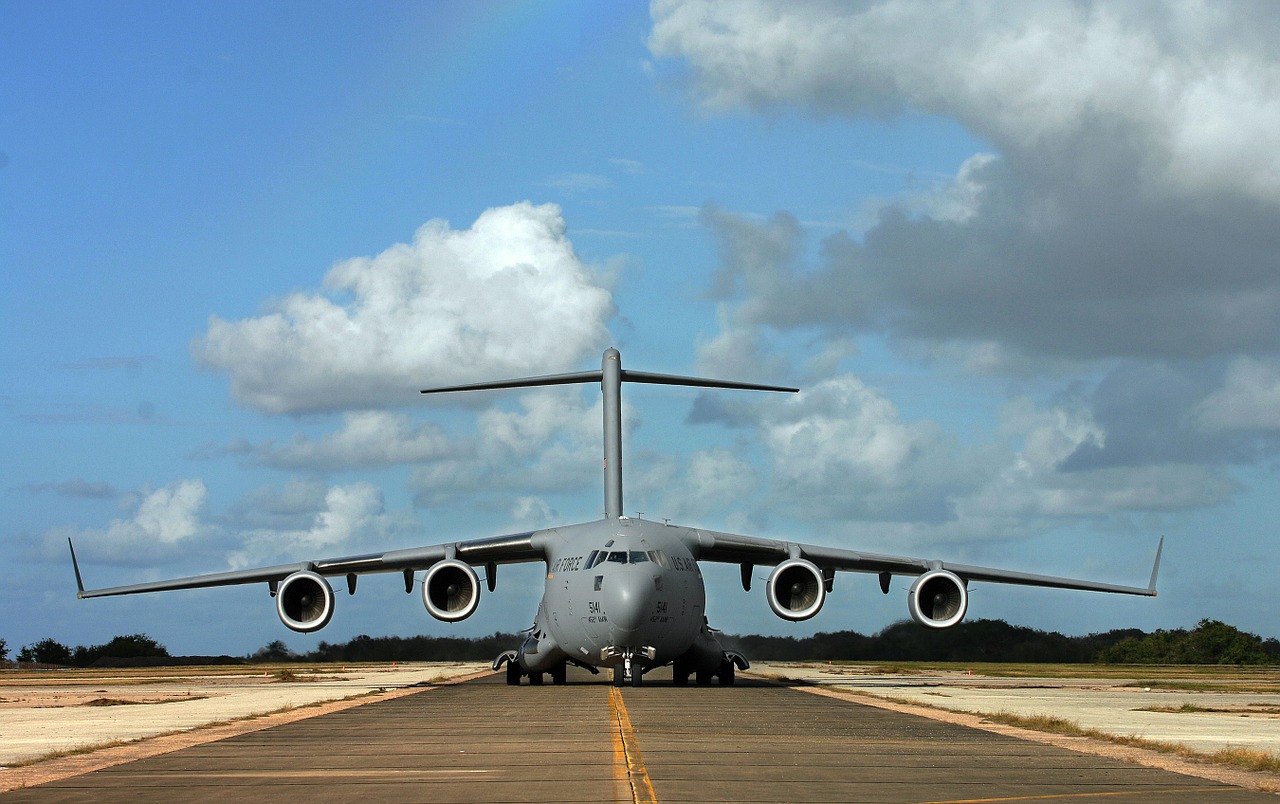 military cargo plane landing runway c-17 free photo