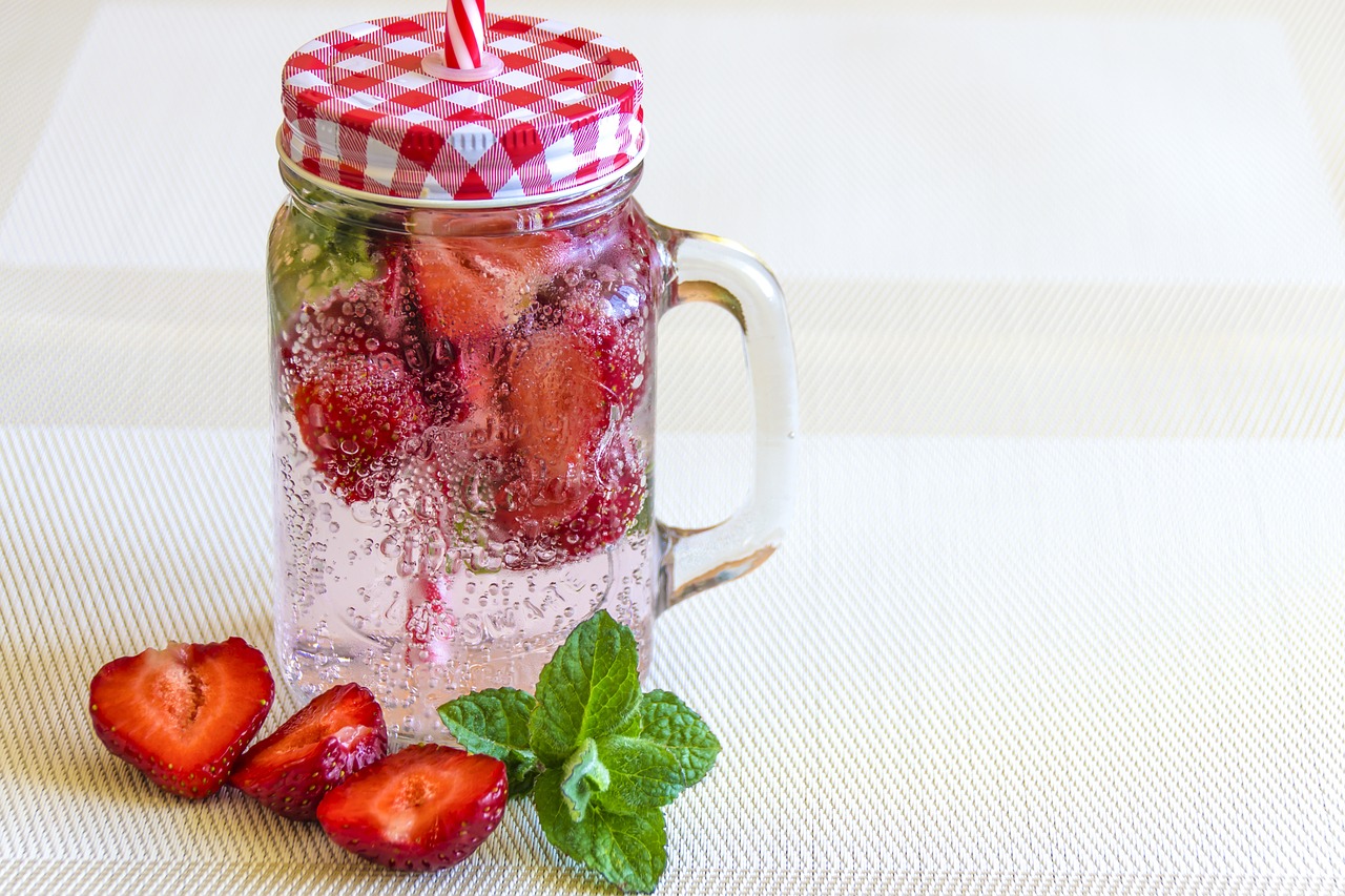 mineral water with strawberries strawberry ice free photo