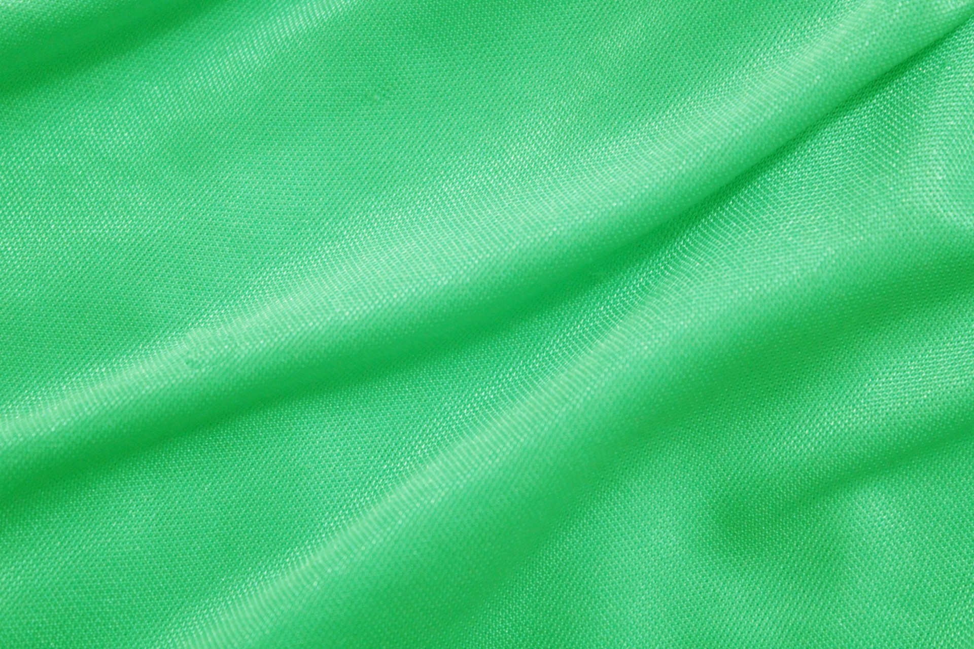 Vải xanh lá cây thanh lịch và sang trọng. Tính năng siêu đa năng của nó cho phép bạn làm bất kỳ sản phẩm may mặc nào, từ áo sơ mi cho đến váy dạ hội.