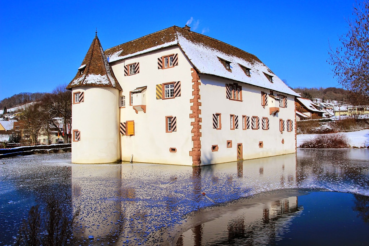 moated castle lake sky free photo