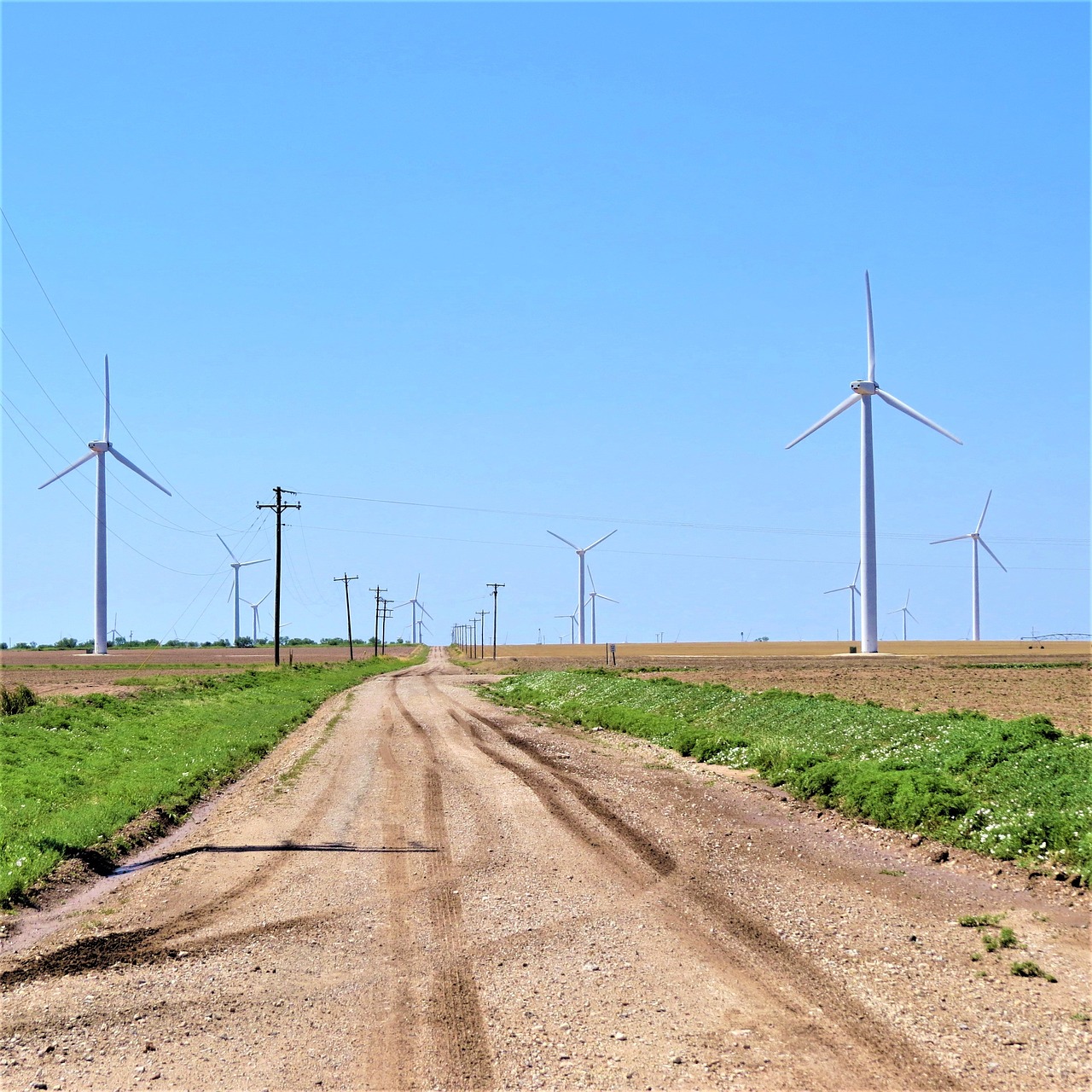 modern windmills road blue sky free photo