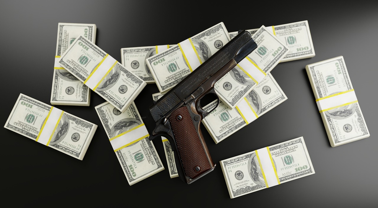 money  dollars  gun free photo