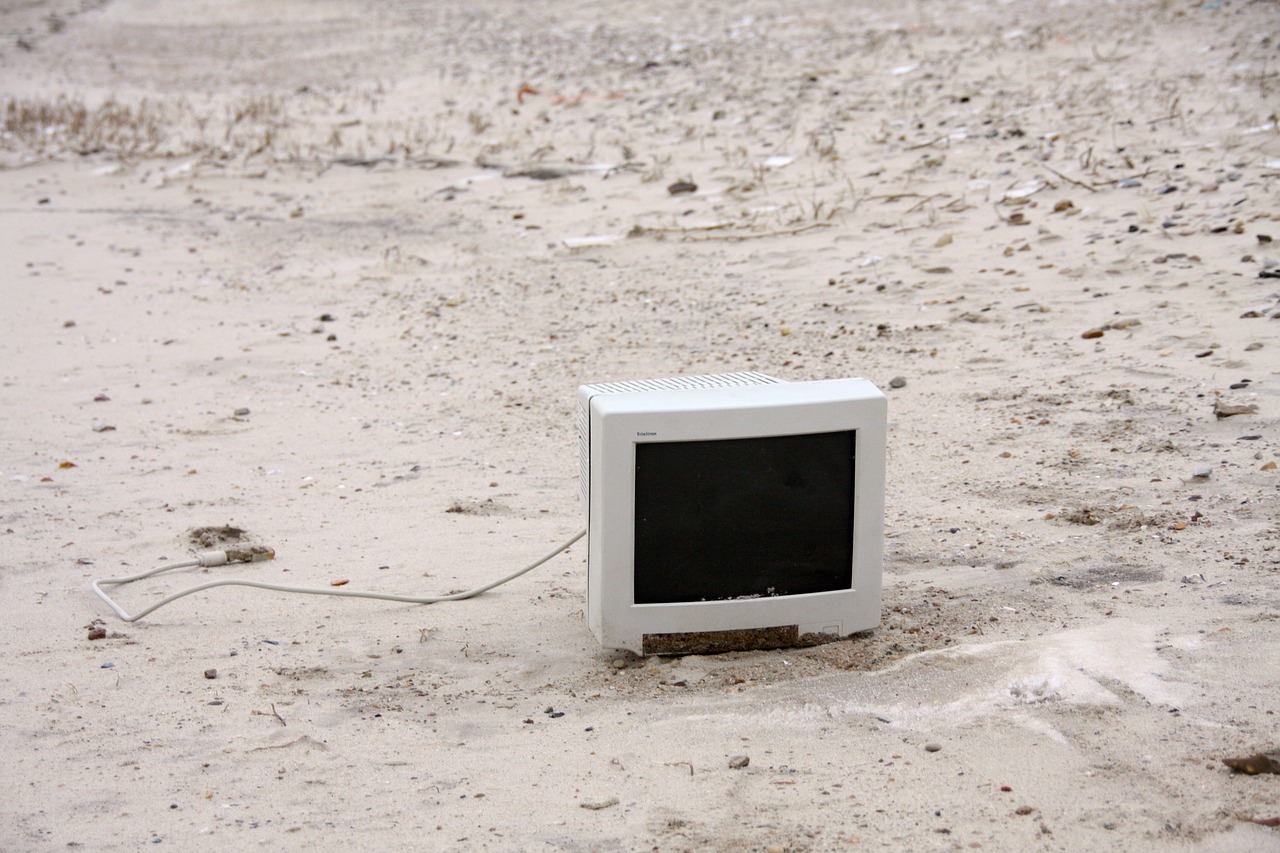 monitor on the beach  washed up on  beach free photo