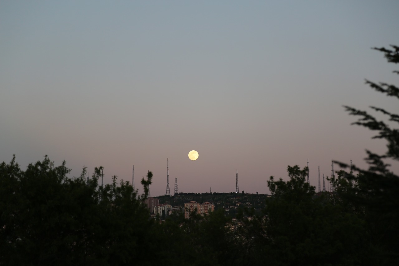 month  moon rising  in the evening free photo