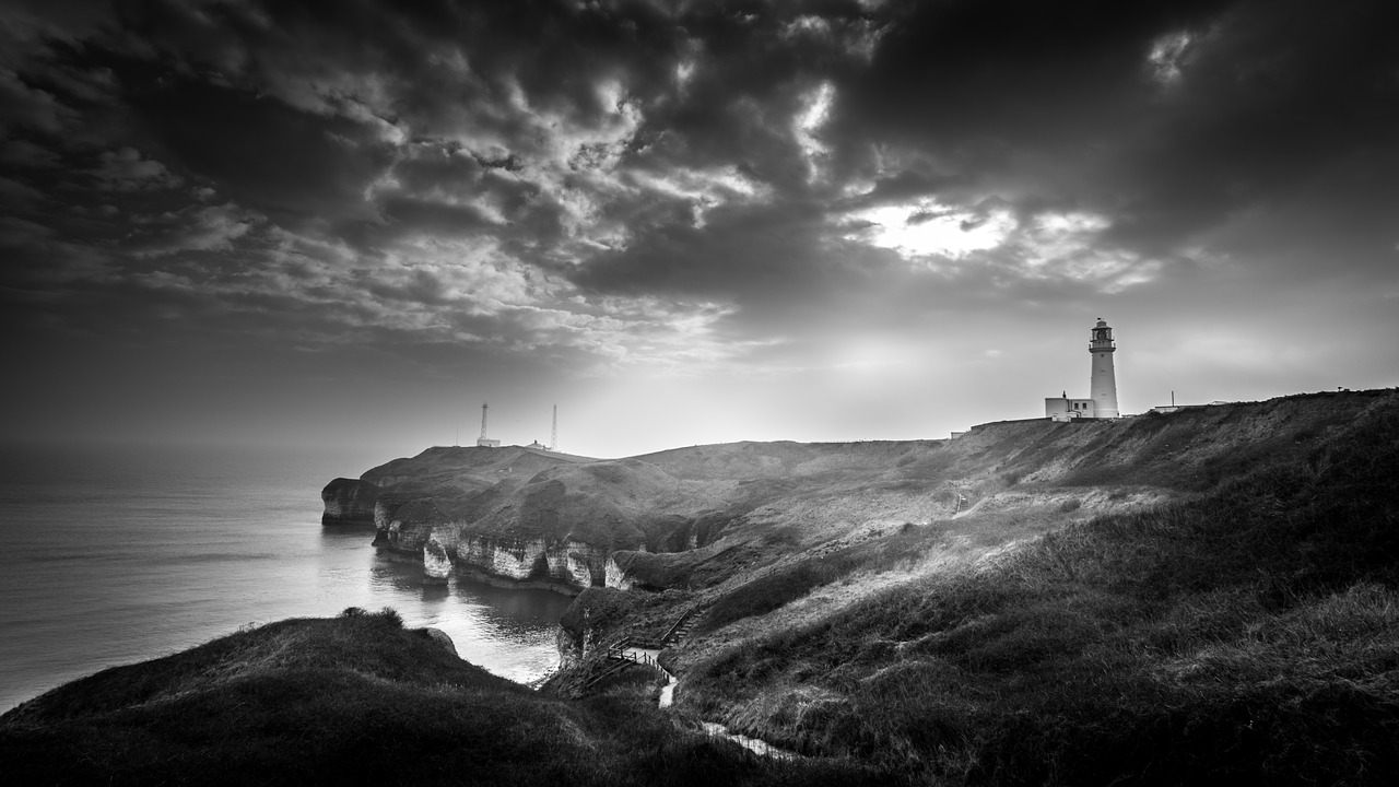 moody seascape lighthouse free photo