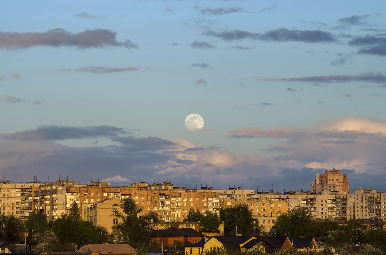 moon sunrise view of the city free photo