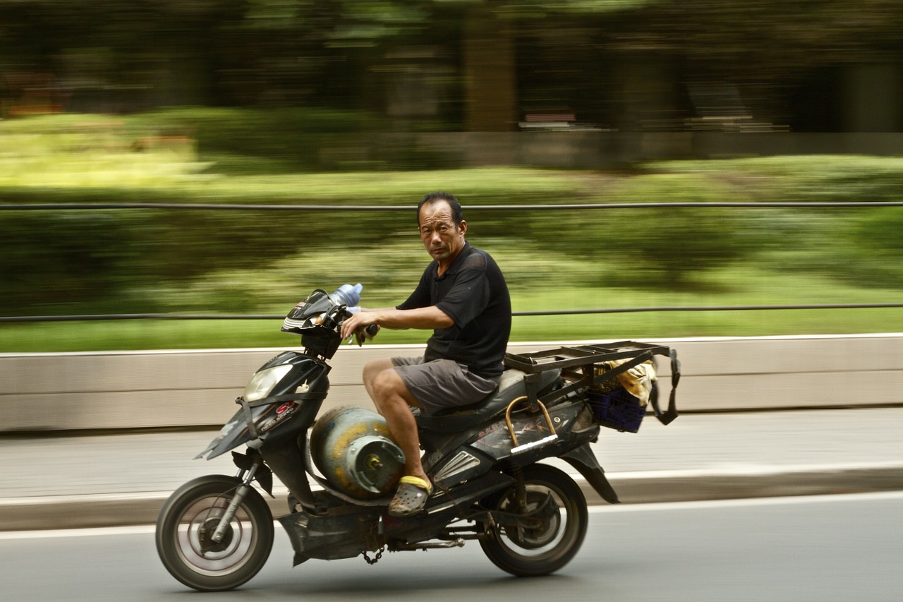 moped riding scooter free photo