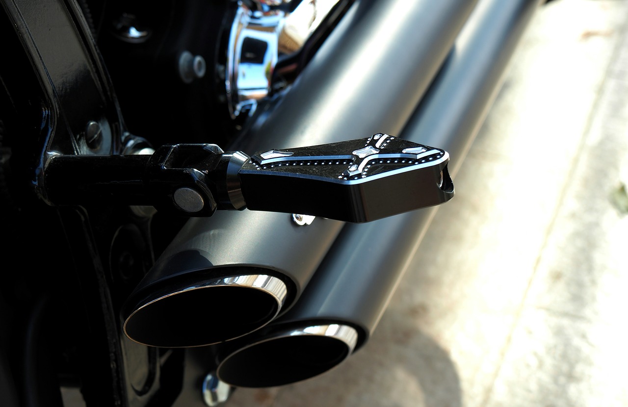 motorcycle hold the foot exhaust free photo
