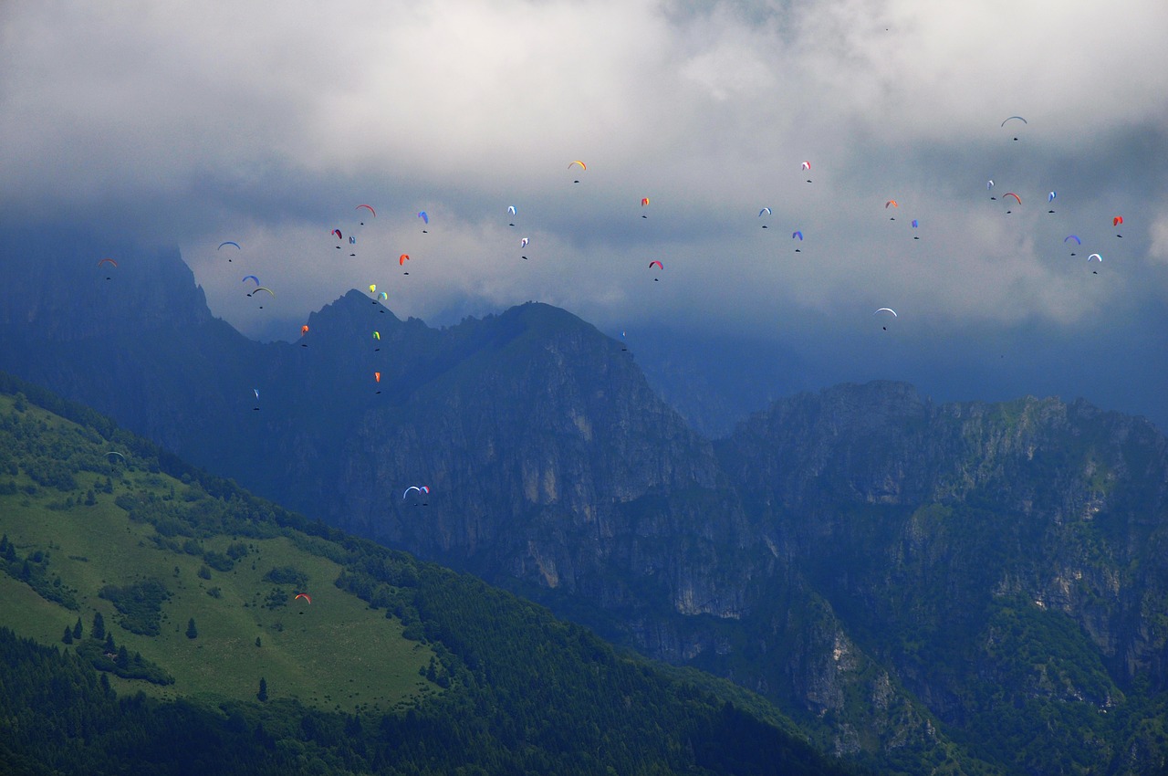 mountains clouds paragliding free photo
