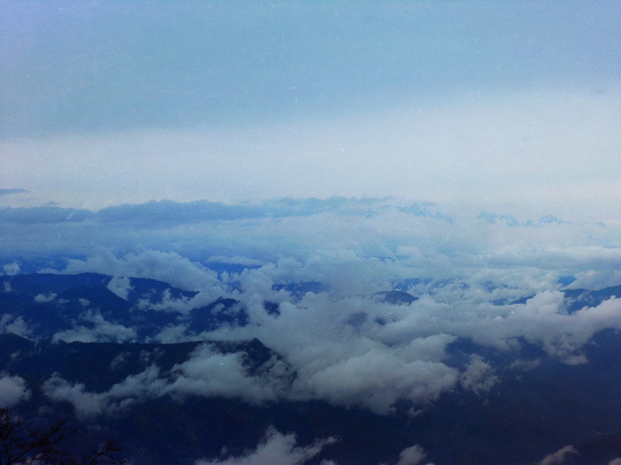 mountains peaks above the clouds free photo