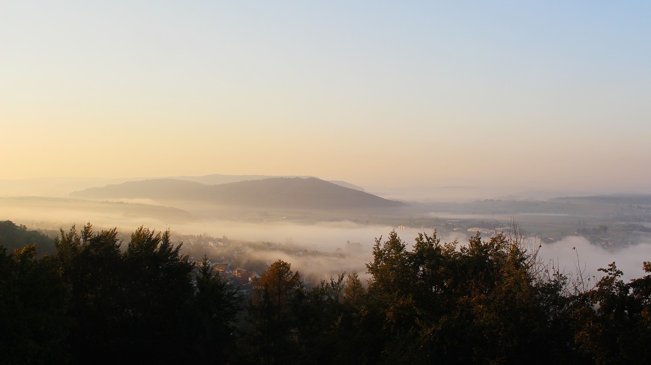 mountains rising fog mountain world free photo