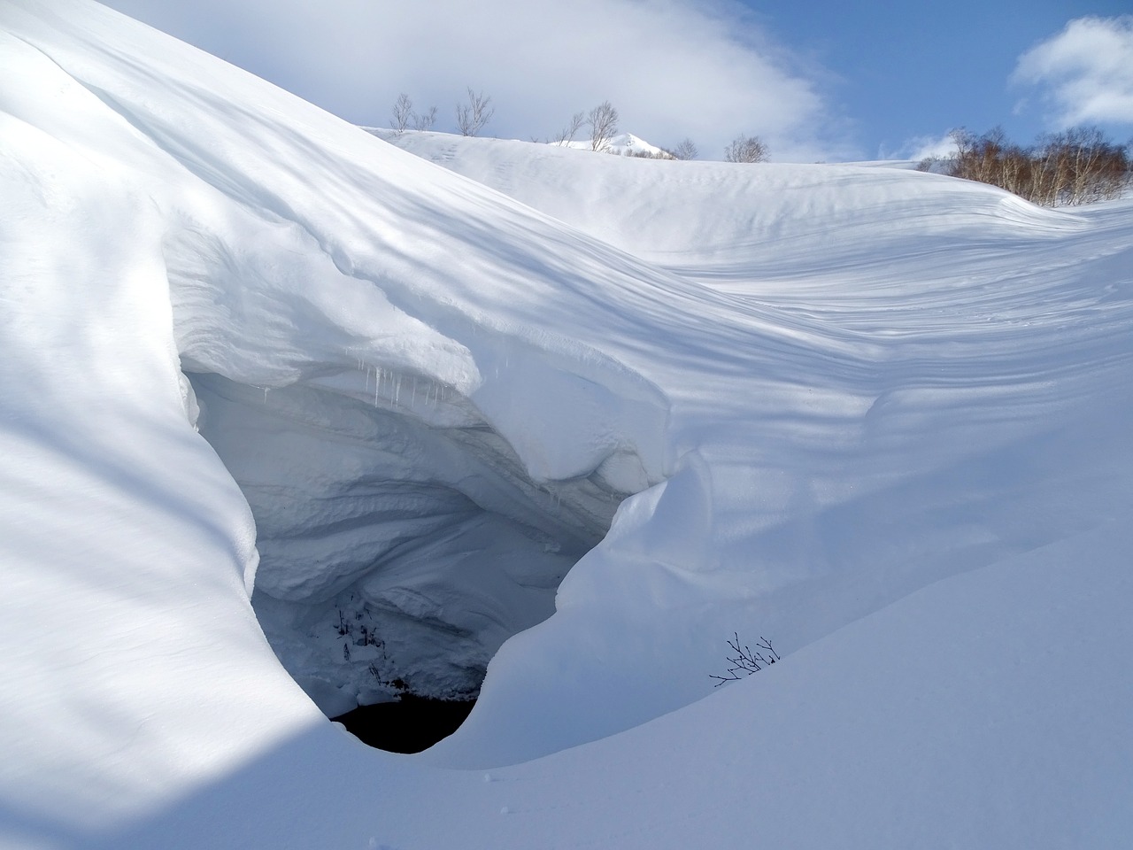 mountains small river snow cave free photo