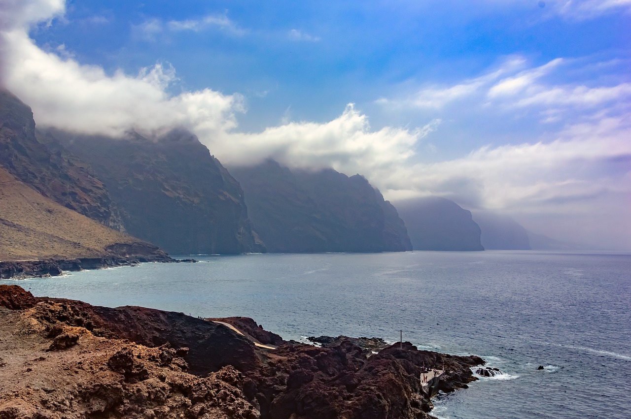 mountains  clouds  sea free photo