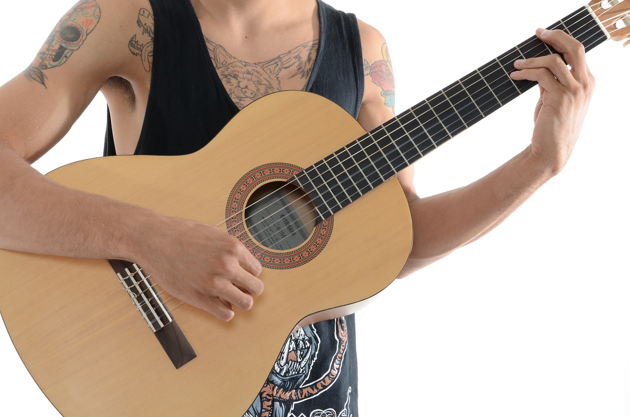 boy tattoos guitar free photo