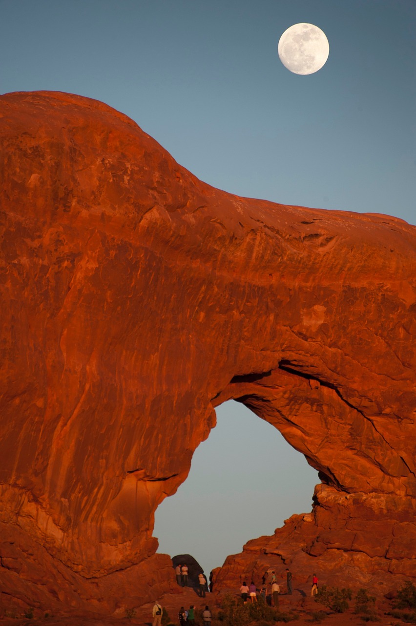 natural rock bridge full moon night free photo