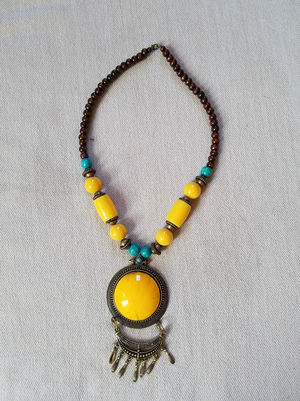 necklace beads and pendant yellow blue and brown necklace free photo