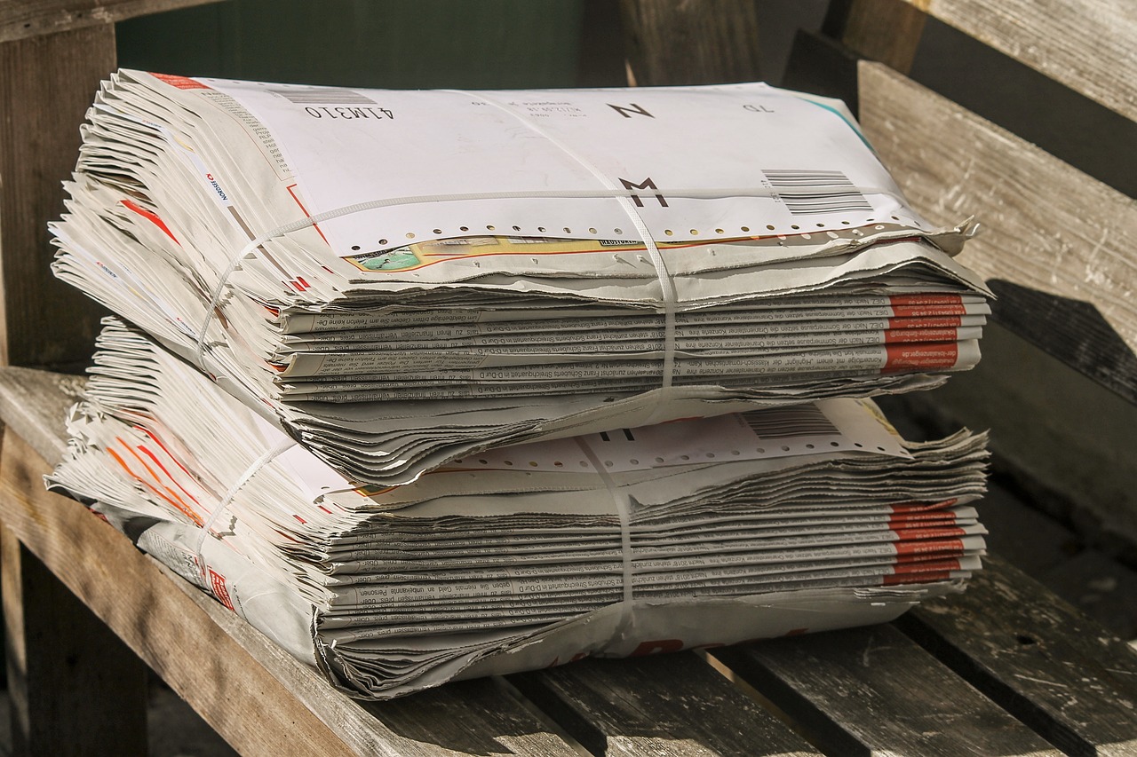 newspapers  stack  bundle free photo