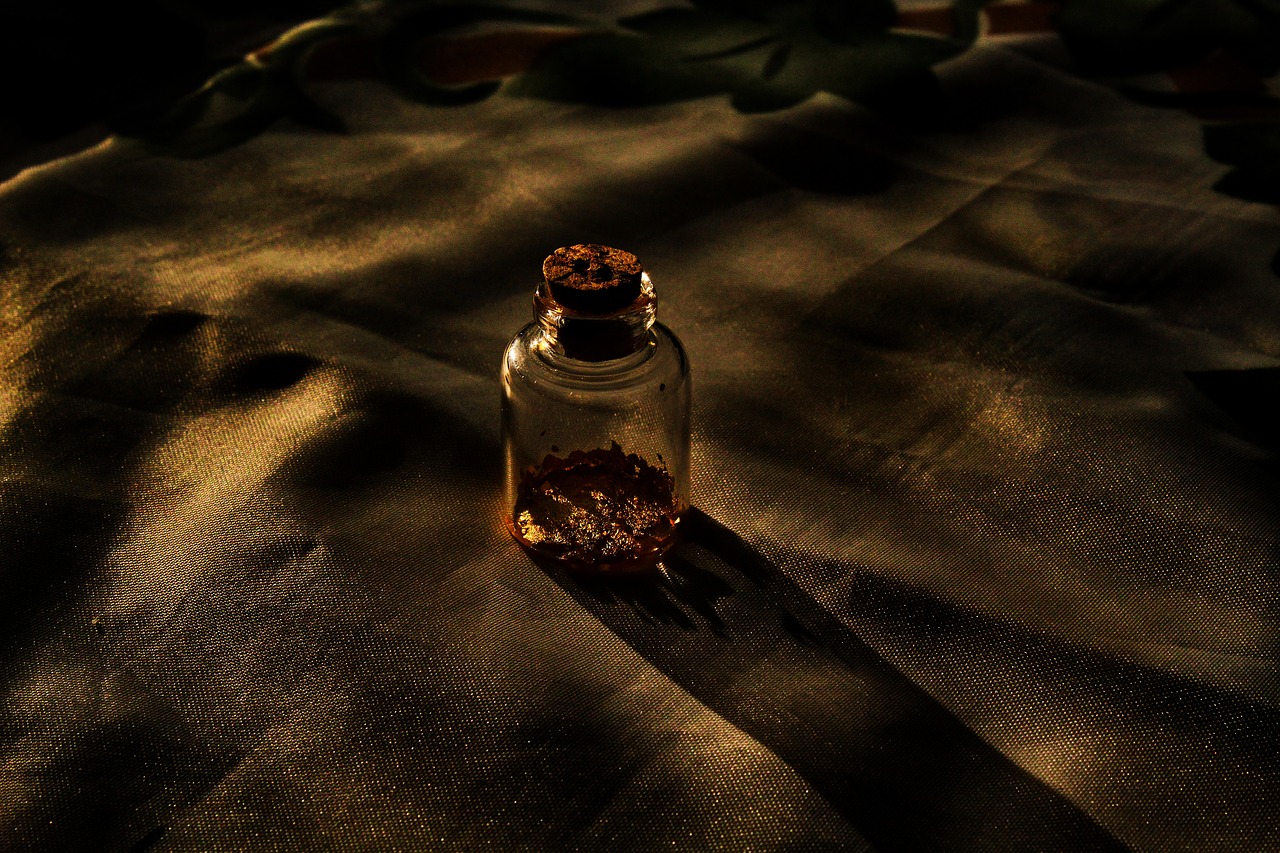 night  vial of gold  gold free photo