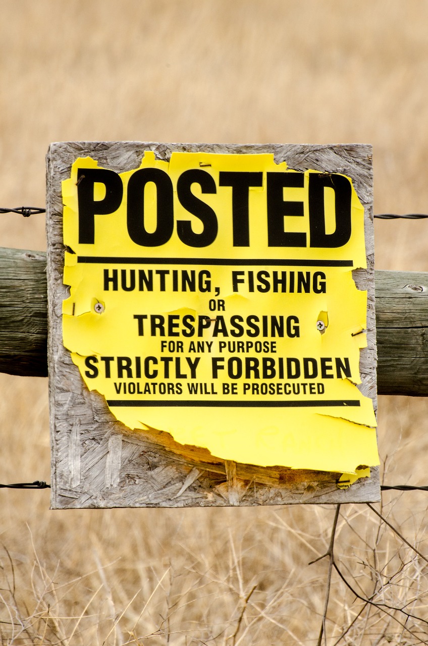 no trespassing sign posted free photo