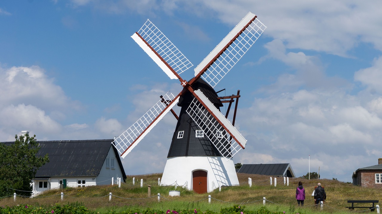 north sea windmill clouds free photo