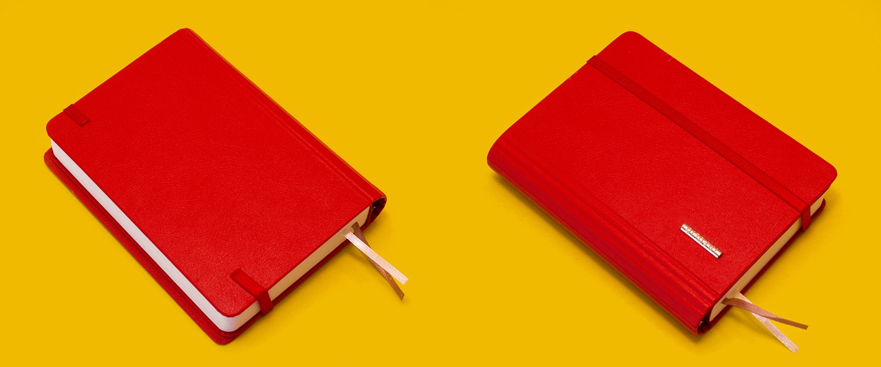 notebook red yellow background free photo