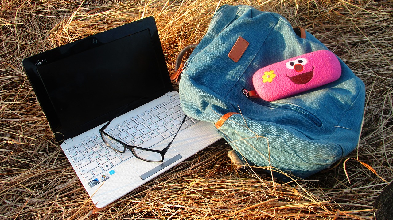 notebook  glasses  backpack free photo